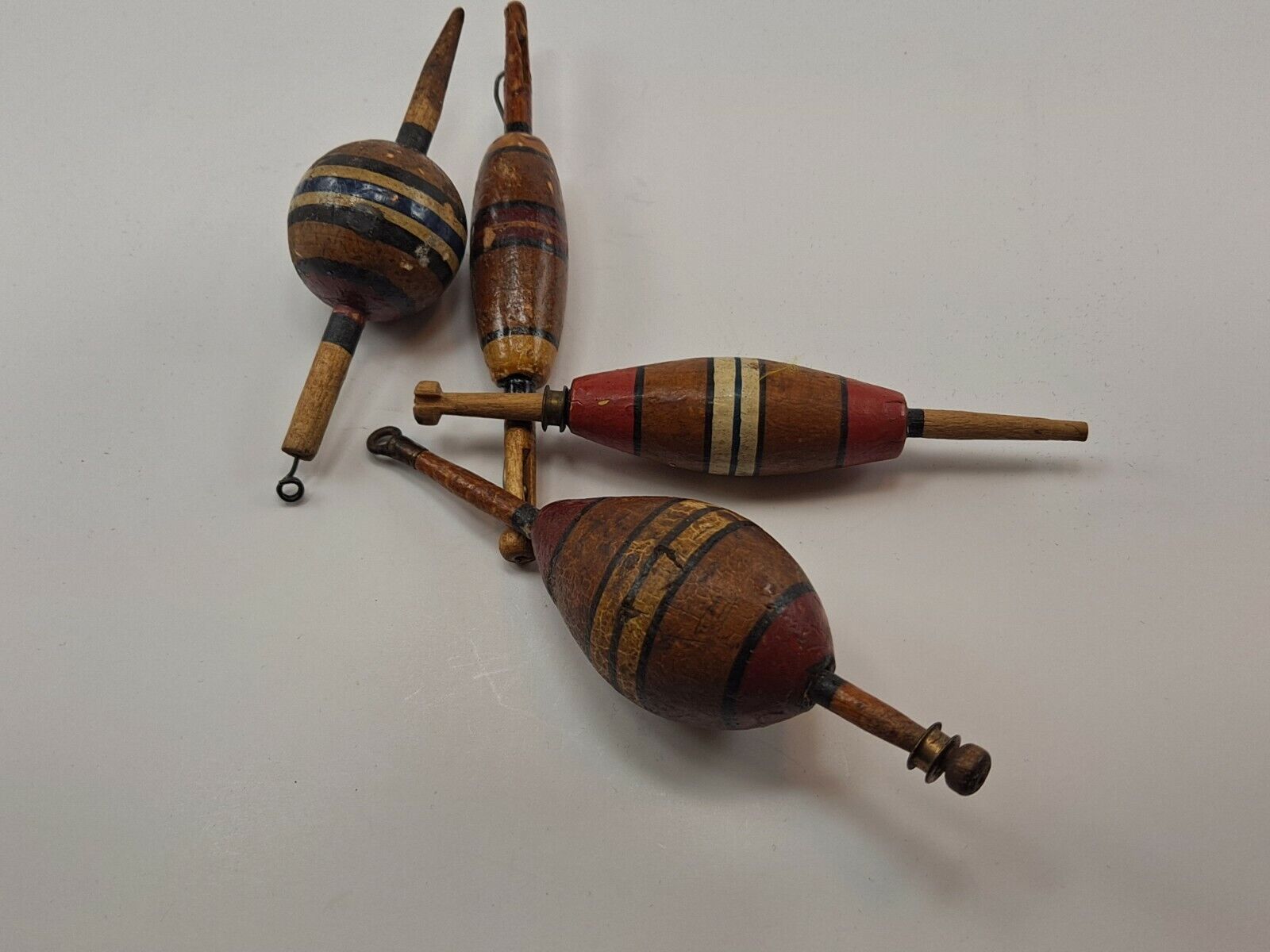 A nice bunch of 4 antique cork fishing floats - vintage bobbers