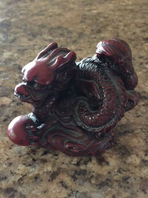 VINTAGE CHINESE RED RESIN DRAGON STATUE/FIGURINE. CARVED.